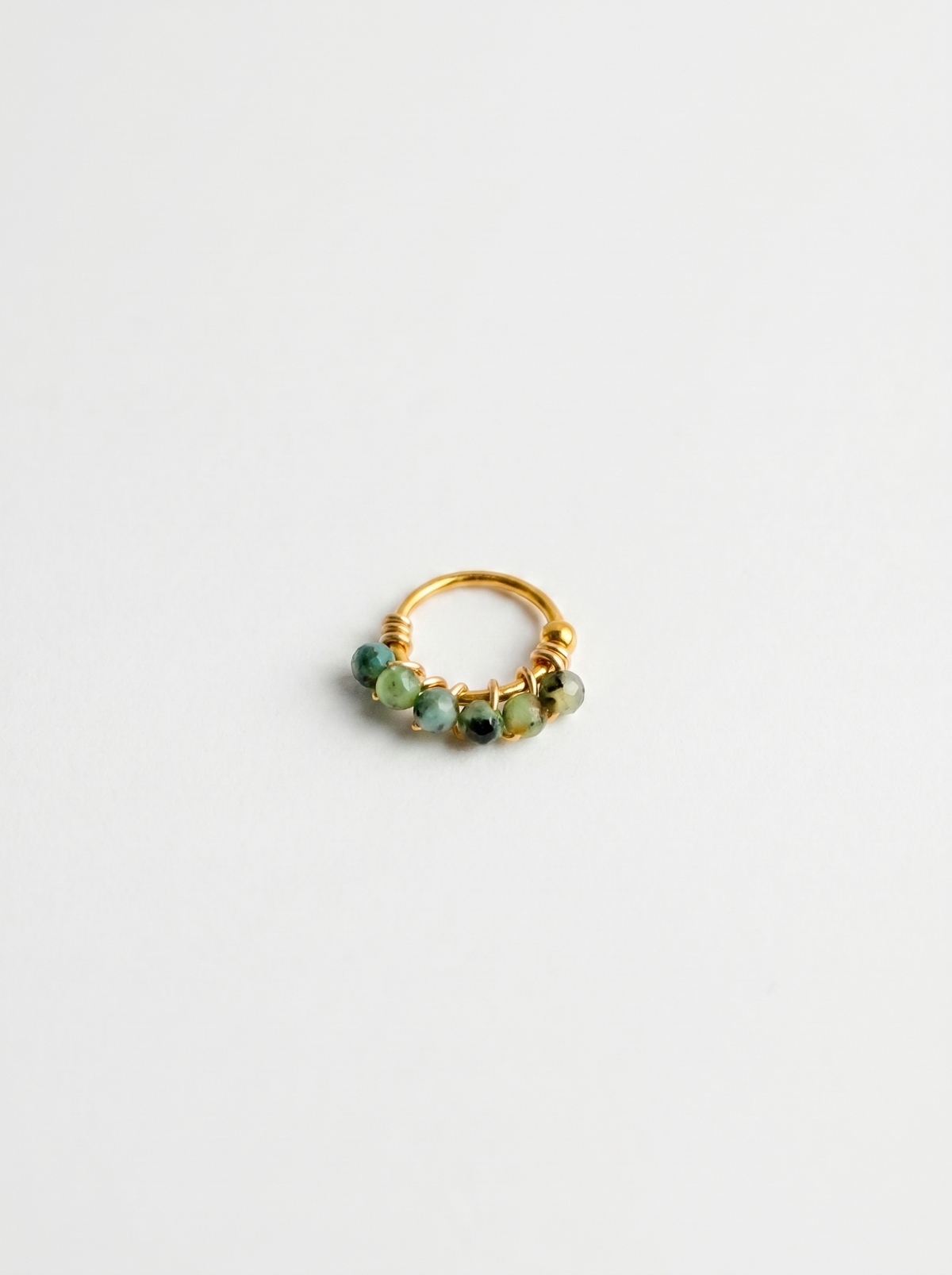 Sello Jade | Piercing con piedras color jade